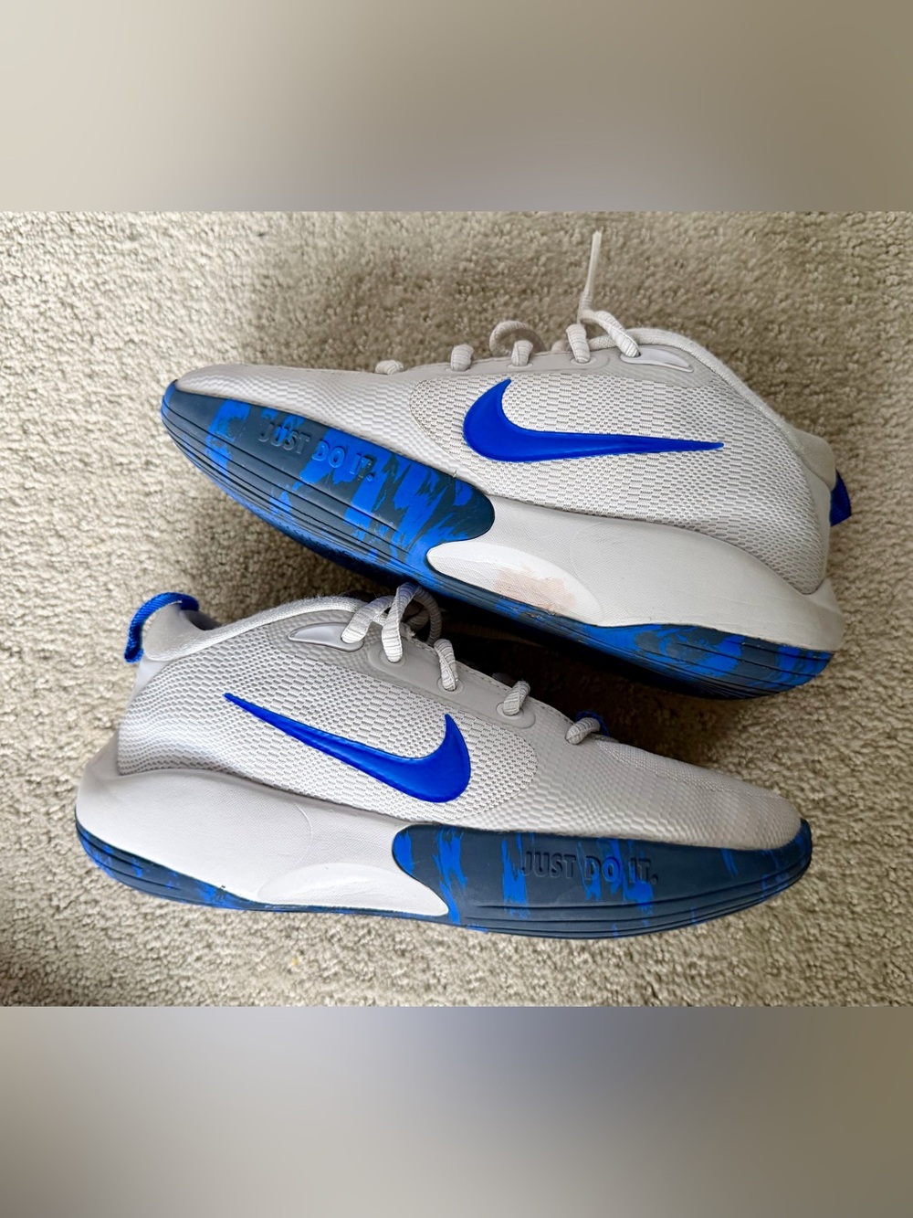 Nike White Sneakers with Blue Swoosh and Blue Accents